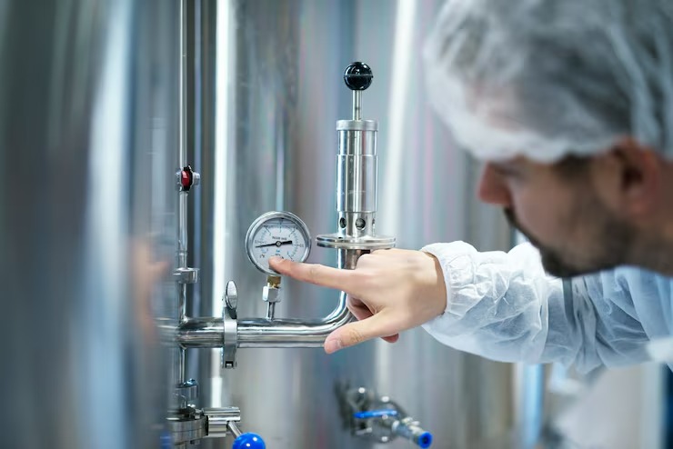 imgi 21 technologist white protective suit checking pressure pressure gauge industrial machine factory 342744 1194